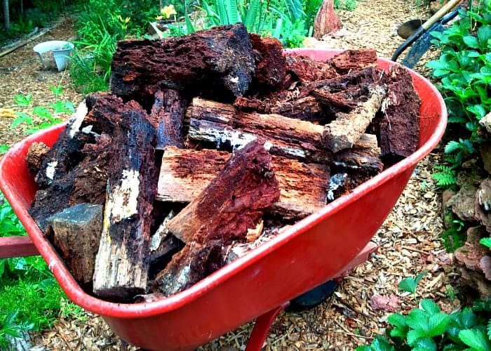 Old logs aren't waste - they're a great base for a hugelkultur bed, a permaculture method for making incredibly rich, long-lasting soil teeming with life.