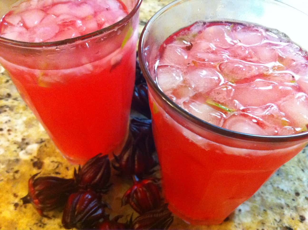 Hibiscus tea with muddled ginger and kaffir lime leaves with stevia for sweetener.