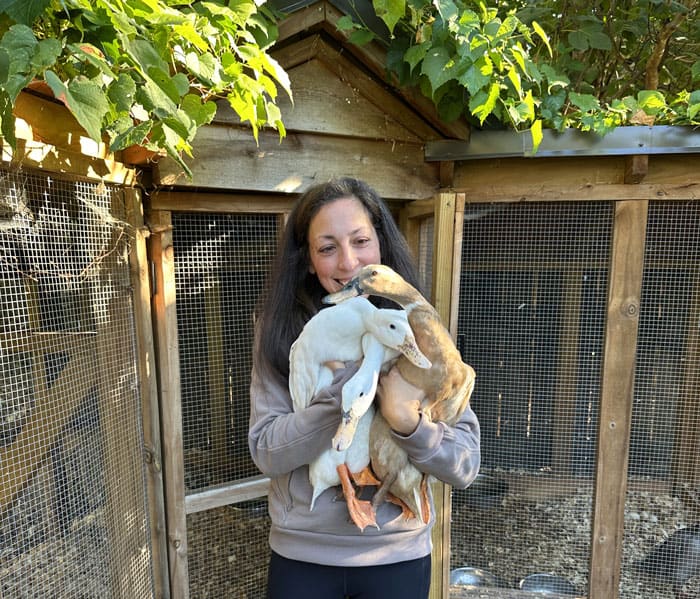 Woman holding ducks